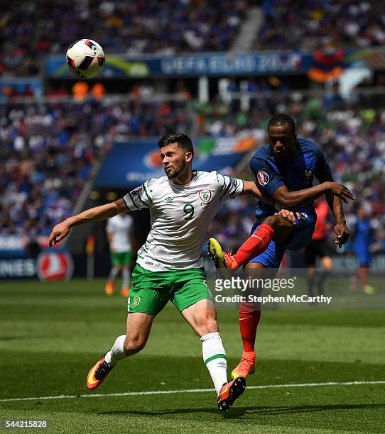 Lyon , France - 26 June 2016; Patrice Evra of France in action against Shane Long of Republic of Ireland during the UEFA Euro 2016 Round of 16 match...