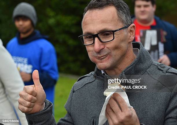 Leader of the Australian Greens Party Richard Di Natale celebrates the freedom of democracy in Australia with a thumbs up after biting into a sausage...