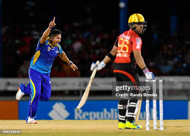 Port of Spain , Trinidad And Tobago - 1 July 2016; Umar Akmal, right, of Trinbago Knight Riders is caught off Ravi Rampaul, left, of Tridents during...