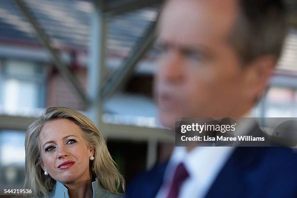 Chloe Shorten looks on as Opposition Leader, Australian Labor Party Bill Shorten speaks with the media during a visit to a polling booth at Colyton...