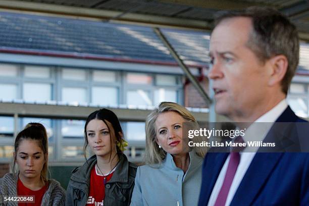 Chloe Shorten looks on as Opposition Leader, Australian Labor Party Bill Shorten speaks with the media during a visit to a polling booth at Colyton...