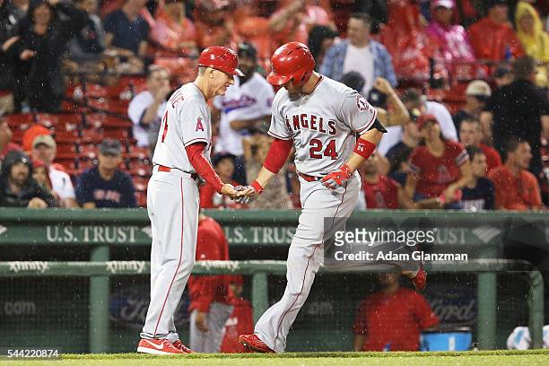 Cron of the Los Angeles Angels of Anaheim rounds the bases after hitting a grand slam in the sixth inning during the game against the Boston Red Sox...