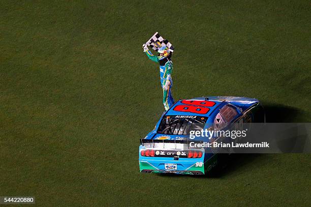 Aric Almirola, driver of the Fresh From Florida Ford, celebrates with the checkered flag on the infield after winning the NASCAR XFINITY Series...