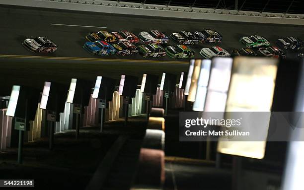 Joey Logano, driver of the Discount Tire Ford, leads a pack of cars during the NASCAR XFINITY Series Subway Firecracker 250 at Daytona International...