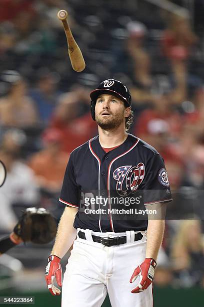 Daniel Murphy of the Washington Nationals flips the bat after striking out in the 13th inning pitches during a baseball game against the Cincinnati...