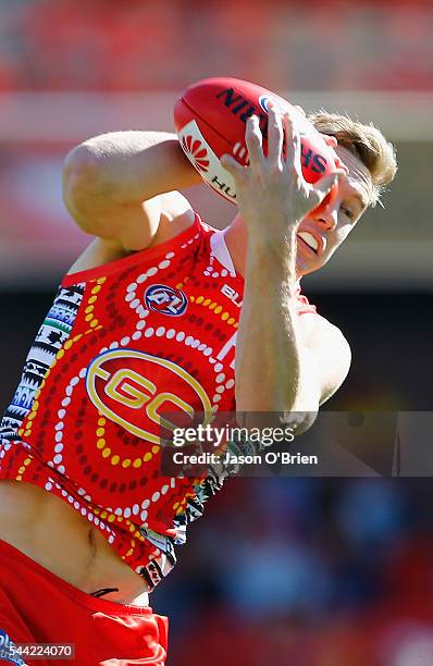 Tom Lynch of the suns takes a mark during the round 15 AFL match between the Gold Coast Suns and the St Kilda Saints at Metricon Stadium on July 2,...