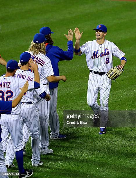 Brandon Nimmo of the New York Mets celebrates the 10-2 win over the Chicago Cubs at Citi Field on July 1, 2016 in the Flushing neighborhood of the...