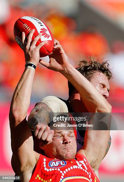 Stephen May of the suns attempts to mark during the round 15 AFL match between the Gold Coast Suns and the St Kilda Saints at Metricon Stadium on...