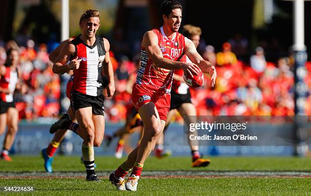 Michael Rischitelli of the suns in action during the round 15 AFL match between the Gold Coast Suns and the St Kilda Saints at Metricon Stadium on...