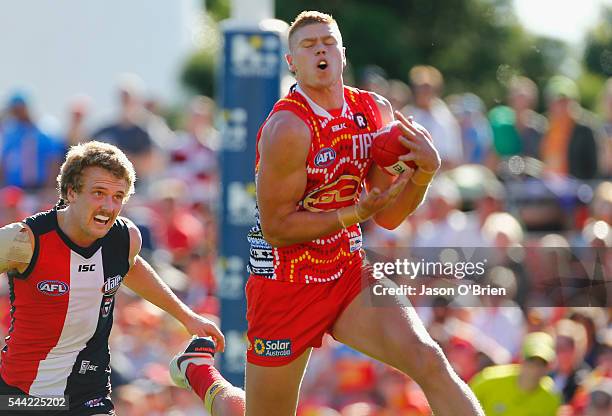 Peter Wright of the suns takes a mark during the round 15 AFL match between the Gold Coast Suns and the St Kilda Saints at Metricon Stadium on July...