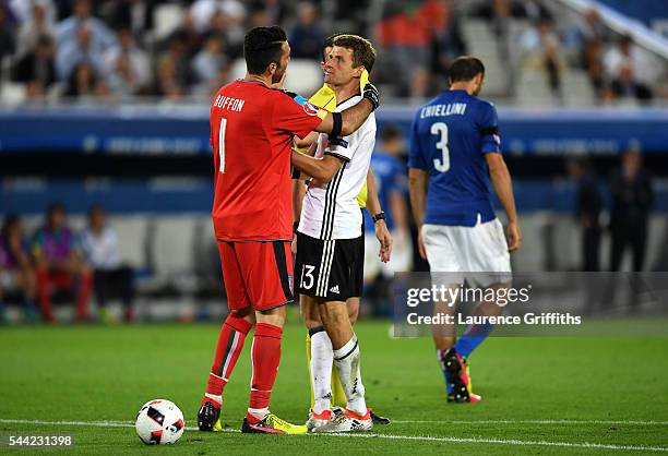 Gianluigi Buffon of Italy talks to Thomas Mueller of Germany during the UEFA EURO 2016 quarter final match between Germany and Italy at Stade Matmut...