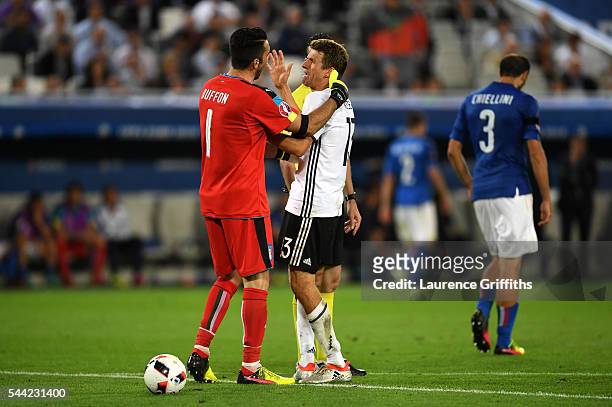 Gianluigi Buffon of Italy talks to Thomas Mueller of Germany during the UEFA EURO 2016 quarter final match between Germany and Italy at Stade Matmut...