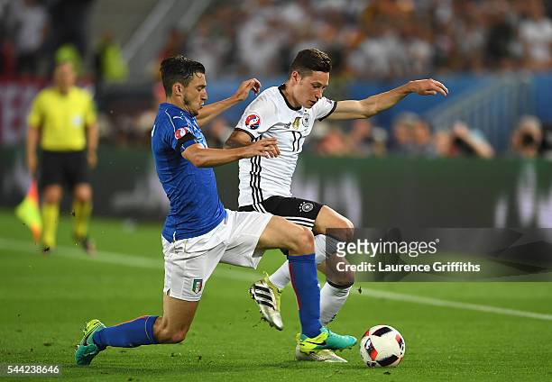 Julian Draxler of Germany and Matteo Darmian of Italy compete for the ball during the UEFA EURO 2016 quarter final match between Germany and Italy at...