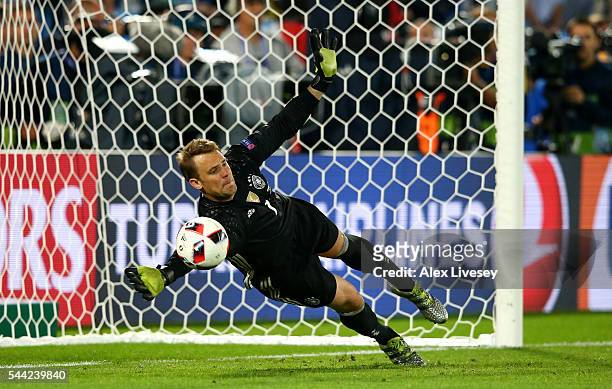 Manuel Neuer of Germany saves the penalty by Leonardo Bonucci of Italy at the penalty shootout during the UEFA EURO 2016 quarter final match between...