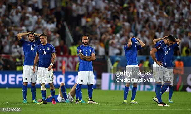Italy players show their dejeciton after their defeat through the penalty shootout during the UEFA EURO 2016 quarter final match between Germany and...
