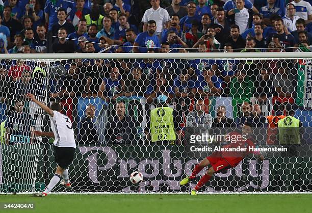 Jonas Hector of Germany scores at the penalty shootout to win the game during the UEFA EURO 2016 quarter final match between Germany and Italy at...