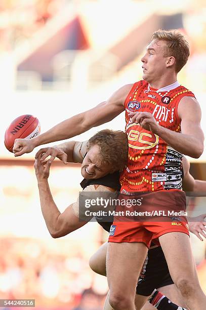Tom Lynch of the Suns competes for the ball against Tom Lee of the Saints during the round 15 AFL match between the Gold Coast Suns and the St Kilda...