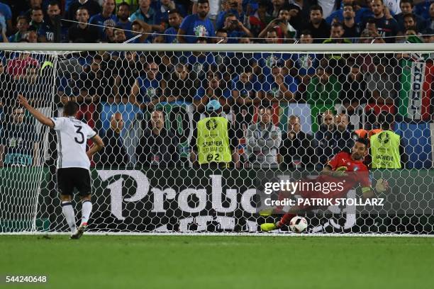 Germany's defender Jonas Hector scores a penalty kick during the Euro 2016 quarter-final football match between Germany and Italy at the Matmut...