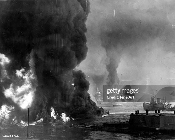 The ocean burns from oil near the Naval Air Station, shortly after the Japanese attack on Pearl Harbor, Hawaii, December 7, 1941. Silver print, Navy...