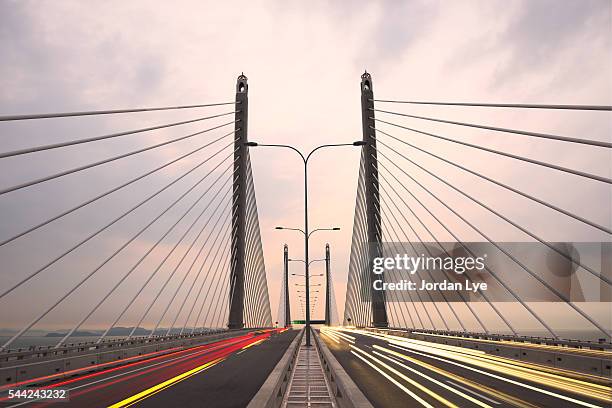 light trails on penang bridge - penang ストックフォトと画像