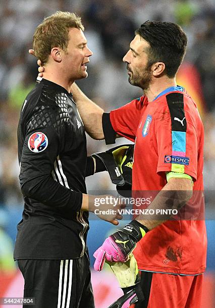 Italy's goalkeeper Gianluigi Buffon congratulates Germany's goalkeeper Manuel Neuer after Germany won the match in nine penalty shoot-outs in the...