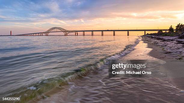 robert moses causeway bridge. beach. long island. fire island. sunset. - robert moses bridge stockfoto's en -beelden