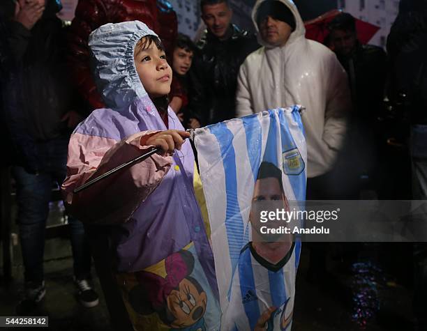 Fans of Argentine football star Lionel Messi Fans rally under the rain asking for his return to the national team at the Obelisco in Buenos Aires on...