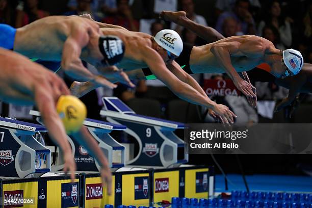 Michael Phelps of the United States dives in to compete in the final heat for the Men's 100 Meter Butterfly during Day Seven of the 2016 U.S. Olympic...
