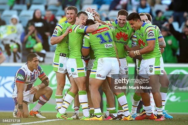 Raiders players celebrate a try by Jarrod Croker during the round 17 NRL match between the Canberra Raiders and the Newcastle Knights at GIO Stadium...