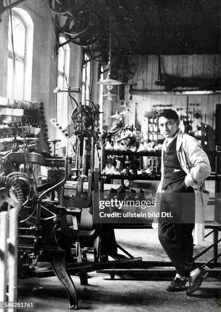 Adolf "Adi" DASSLER , German entrepreneur, founder of the German sportswear company "adidas", Dassler in a shoe factory, date unkown, c1920s,...