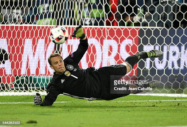 Goalkeeper of Germany Manuel Neuer stops the ball during the penalty shootout of the UEFA Euro 2016 quarter final match between Germany and Italy at...