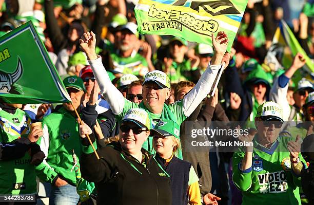 Raiders fans celebrate winng the round 17 NRL match between the Canberra Raiders and the Newcastle Knights at GIO Stadium on July 3, 2016 in...