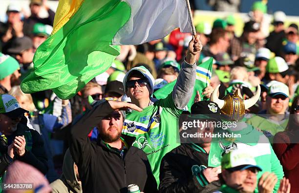 Raiders fans celebrate winng the round 17 NRL match between the Canberra Raiders and the Newcastle Knights at GIO Stadium on July 3, 2016 in...