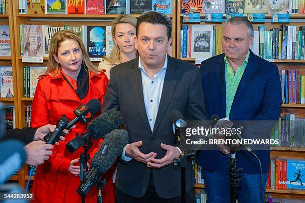 Nick Xenophon , leader of the Nick Xenophon Team political party, speaks to the press in front of his team candidates Rebekha Sharkie , Skye...
