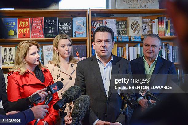 Nick Xenophon , leader of the Nick Xenophon Team political party, speaks to the press in front of his team candidates Rebekha Sharkie , Skye...