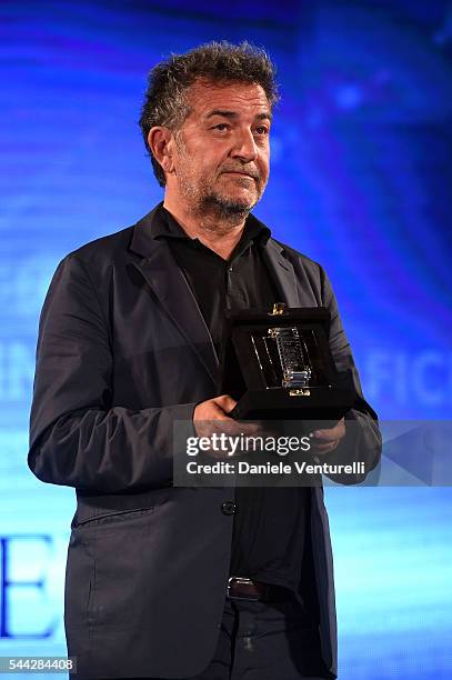 Pietro Valsecchi receives Nastro D'Argento on stage during the Nastri D'Argento Awards Ceremony on July 2, 2016 in Taormina, Italy.