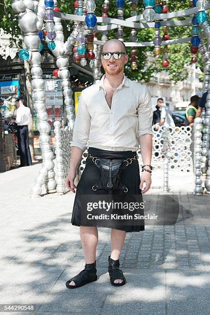 Guest Steven Locascio wears a vintage skirt, Damir Doma shirt, Skingraft shoes and Louis Vuitton sunglasses on day 2 of Paris Collections: Men on...