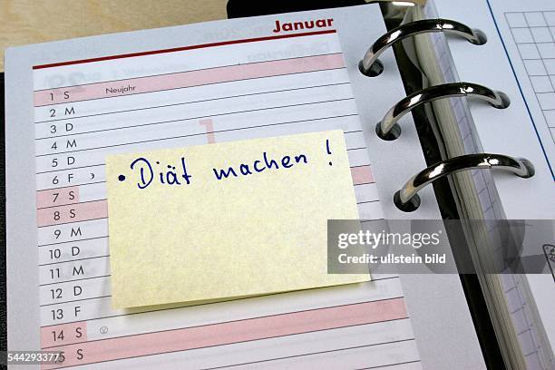 Symbol Neujahrsvorsatz, gute Vorsätze zum neuen Jahr, Post-it Merkzettel in einem Notizbuch mit dem Vorsatz "Diät machen!"- 2006