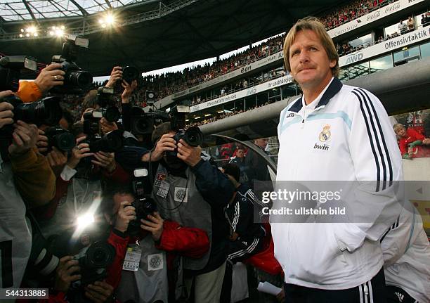 Bernd Schuster - coach, Real Madrid, Germany: surrounded by press photographers