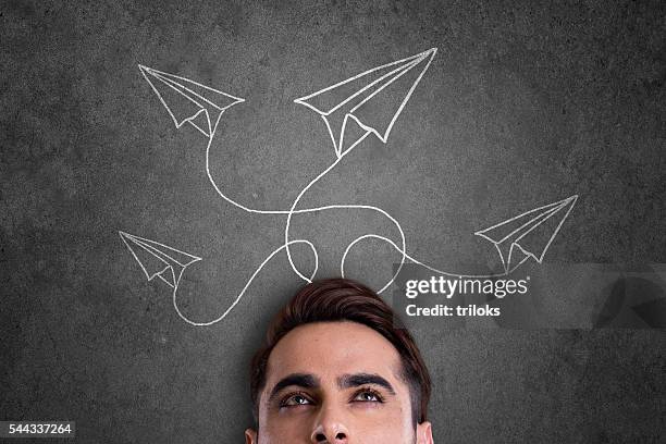 man with paper airplane - dream deliveries stock pictures, royalty-free photos & images