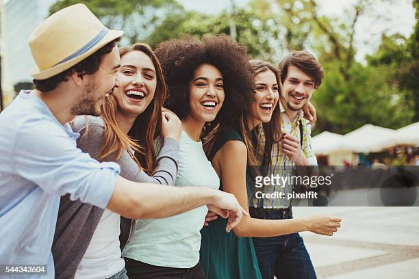friends having good time on the street - guy girl street laugh stock pictures, royalty-free photos & images
