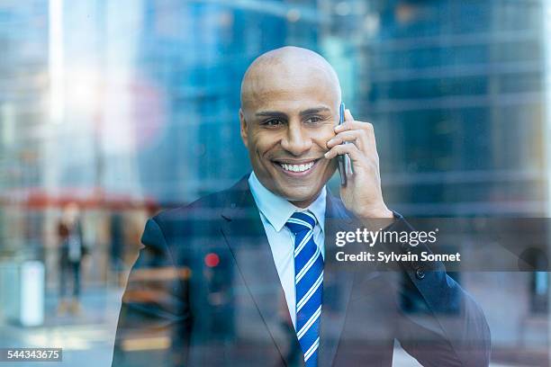 businessman using a mobile phone - striped suit stock pictures, royalty-free photos & images