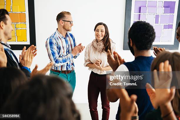 artist and gallery owner during opening - store opening stock pictures, royalty-free photos & images
