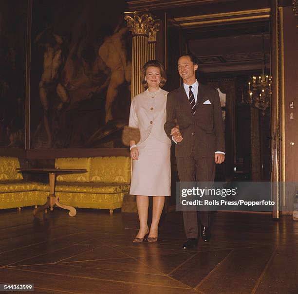 Princess Irene of the Netherlands walks hand in hand with Carlos Hugo, Duke of Parma through the Royal Palace in Madrid, Spain after the announcement...