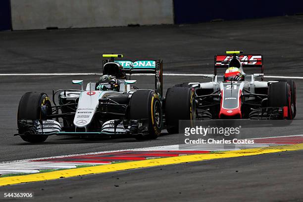 Nico Rosberg of Germany driving the Mercedes AMG Petronas F1 Team Mercedes F1 WO7 Mercedes PU106C Hybrid turbo leads Esteban Gutierrez of Mexico...