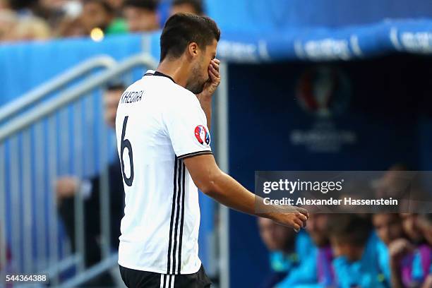 Injured Sami Khedira of Germany walks off the pitch after being replaced during the UEFA EURO 2016 quarter final match between Germany and Italy at...