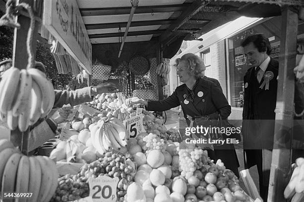 British Conservative Party Education Secretary, and MP for Finchley, Margaret Thatcher shopping at a fruit stall during the UK general election...