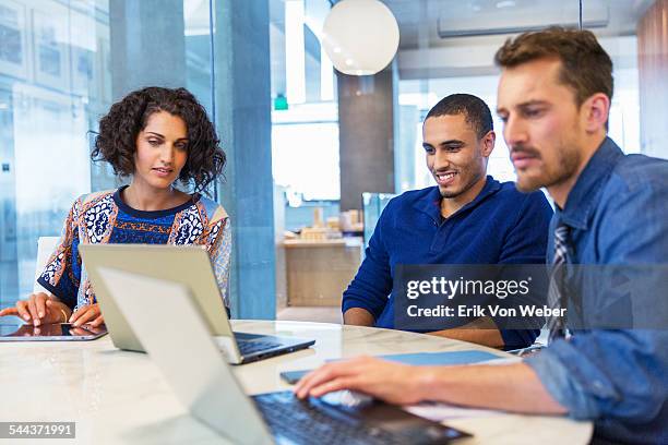 colleagues watching video in conference room - color image stock pictures, royalty-free photos & images