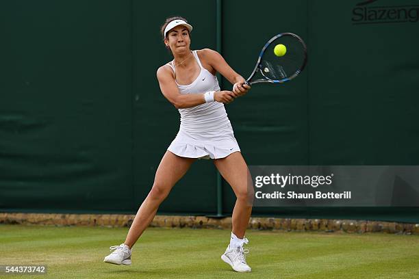 Ema Lazic of Great britain plays a backhand during the Girl's singles first round match against Rabeka Masarova of Switzerland on Middle Sunday of...