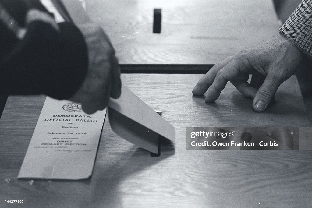 Voter Putting Ballot into Box